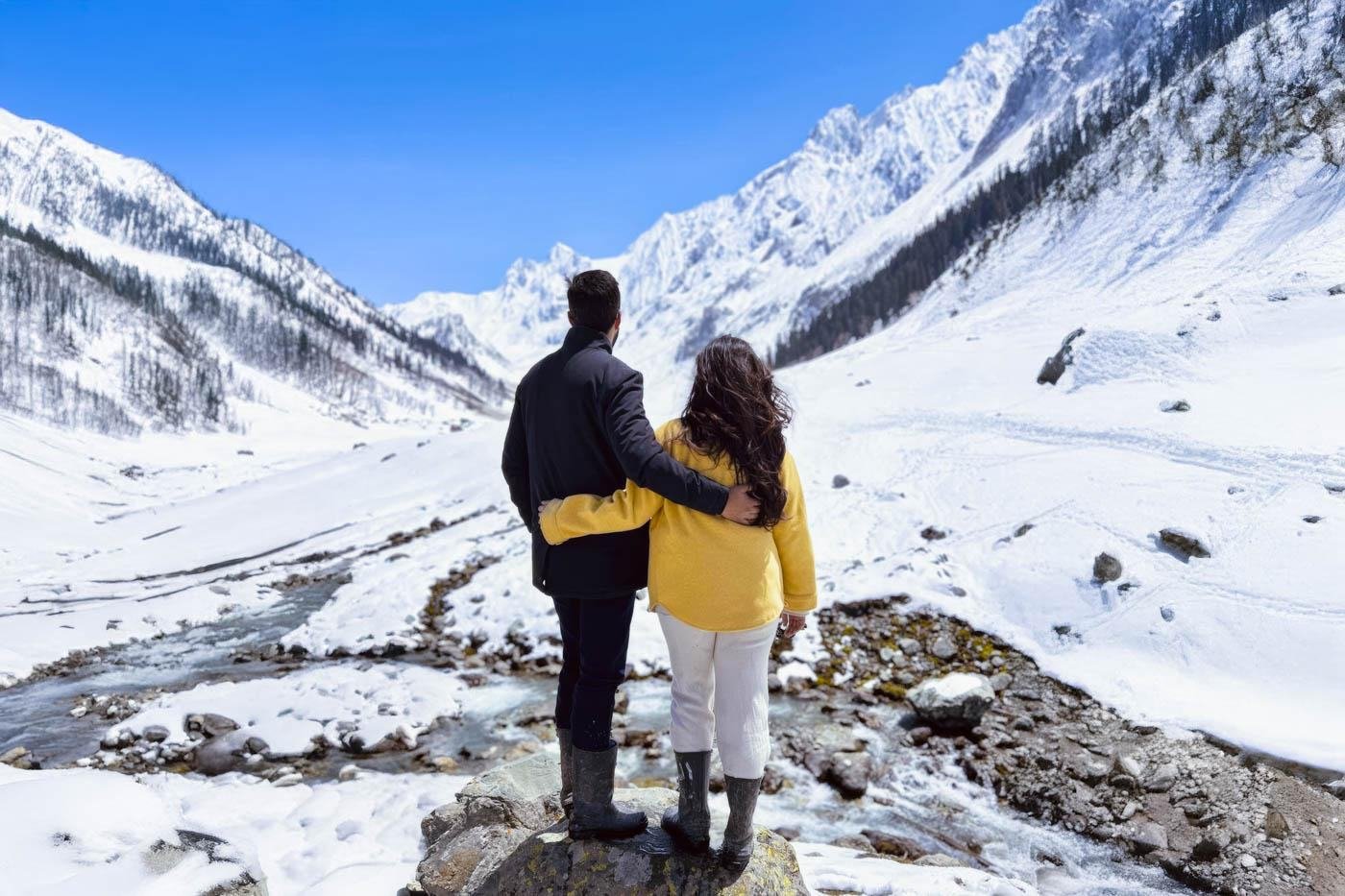 Couple at a snow valley