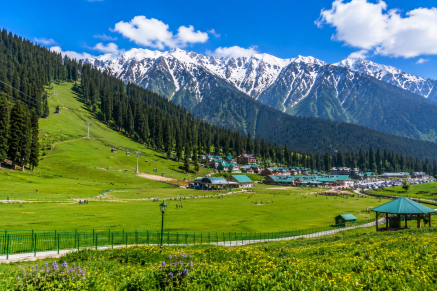 Snow-covered meadows and gondola at Gulmarg